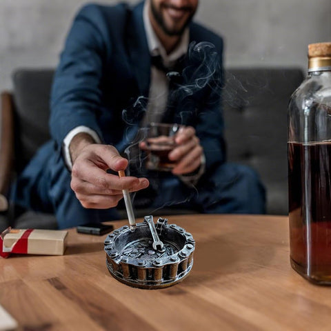 Man using Vintage Motorcycle Chain Ashtray With Wrench And Bike Motif For Biker Bars Harleys And Smoking Rooms A Dope Gift For Men Mechanics Smokers Great Desk Accessory For Man Caves And Home Bars on table
