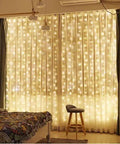 9.8 By 9.8 Feet 300 LED Curtain Lights With USB Plug, Waterproof IP44 Fairy String Lights illuminating a bedroom window