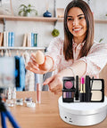 Herxsin Electric Rotating Display Stand 360 Degree Motorized Turntable With Usb Power Cable showcasing makeup tools on a white finish platform.