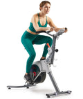 Woman using Prime Magnetic Belt Drive Indoor Stationary Cycling Bike With Bluetooth App Connectivity And Two Stage Transmission System