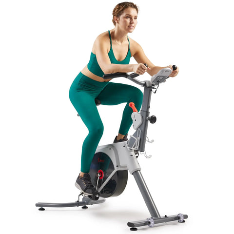 Woman using Prime Magnetic Belt Drive Indoor Stationary Cycling Bike With Bluetooth App Connectivity And Two Stage Transmission System