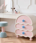 Set Of Six Star Shaped Ceramic Cabinet Knobs With Glossy Finish For Kitchen Drawers And Dressers displayed on pink dresser.