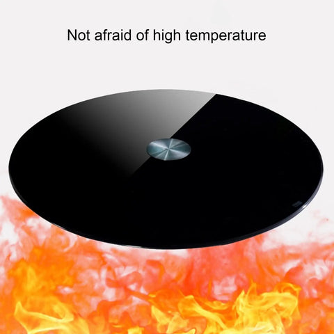 360 Degree Rotating Lazy Susan Turntable For Dining Tables And Kitchen Countertops Black Tempered Glass Base shown over flames