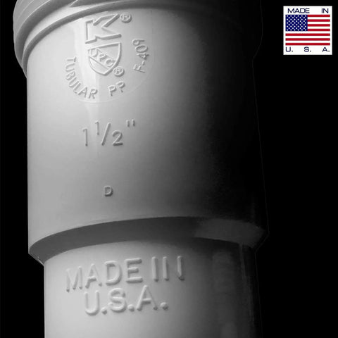 Close-up of white polypropylene P Trap Kit for 1 1/4 Inch Drain, Made in USA, showing size marking and text detail