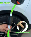 Heavy Duty Liquid Siphon Pump With Three Foot PVC Hose, user squeezing pump to transfer fuel easily and efficiently.