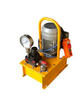 Heavy Duty Workhorse Portable Electric Hydraulic Power Pack Delivering Rock Solid 10000 Psi Flow With Seamless Dual Voltage Hookup For Mechanic Bays And Commercial Garages - close-up showing pressure gauge and motor.