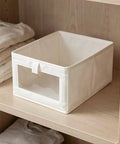 Straight Up Durable Cotton Linen Foldable Closet Organizer Bins Set Of Three With Tough Handles And Clear Window Collapsible Fabric Storage Cube on shelf.