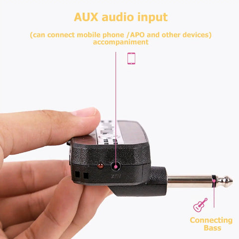 Close-up of Portable Guitar Headphone Amp For Quiet Practice, Compact Desktop Device With High Fidelity Sound, JA-01 in hand.