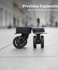 Game Changer Twin Roller Luggage Wheel Replacement Hub With Metal Ball Bearing Insert For Suitcase Repair showing black wheels on pavement.