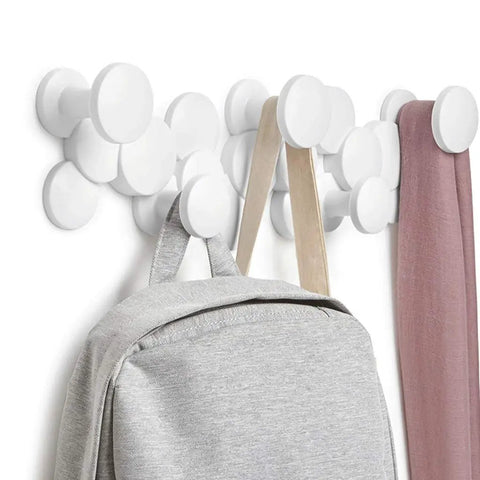 Slick Scandinavian Wall Mounted Coat Hooks Knockout Resin Organizer with gray backpack and scarf in hallway.