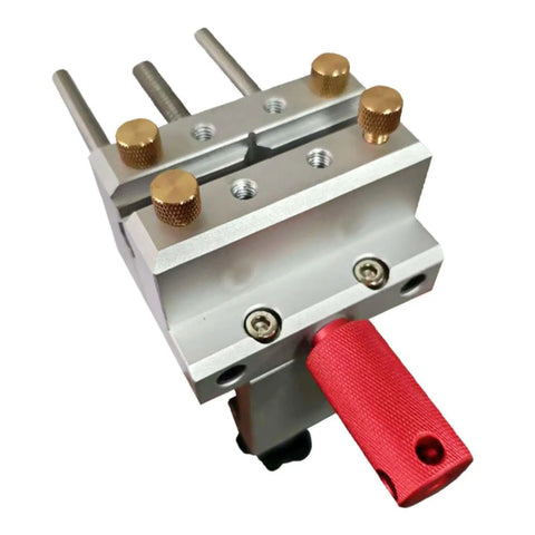 Close-up of Small Bench Vise For Home DIY Repairs And Jewelry Making with red handle and dual locking handles