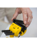 Person adjusting yellow and black MaxSteel Multi Angle Hobby Vice With 360-Degree Ball Joint, showing rubber jaw cover removal