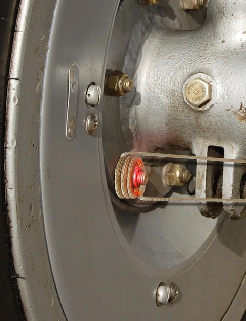 Solary induction heater coil assembly with copper windings inside a metal housing.