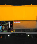 Inside view of Heavy Duty Battery Powered Machinery Transport Dolly With Wireless Remote Control showing electric components and a battery.