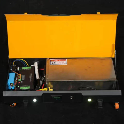 Inside view of Heavy Duty Battery Powered Machinery Transport Dolly With Wireless Remote Control showing electric components and a battery.