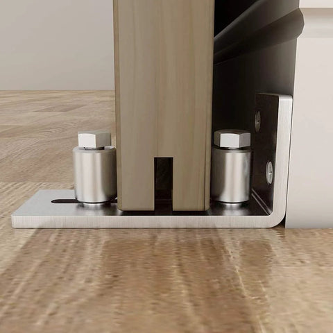 Close-up of stainless steel sliding door guides floor mount with adjustable rollers, wall-mounted, doors up to 2.125 inches thick.