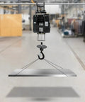 Heavy Duty Electric Hoist With 1102 Lb Capacity And Wired Remote Control Lift For Garage Shop Or Factory Jobs Featuring Fast 1800W Copper Motor lifting a metal sheet from the ground.