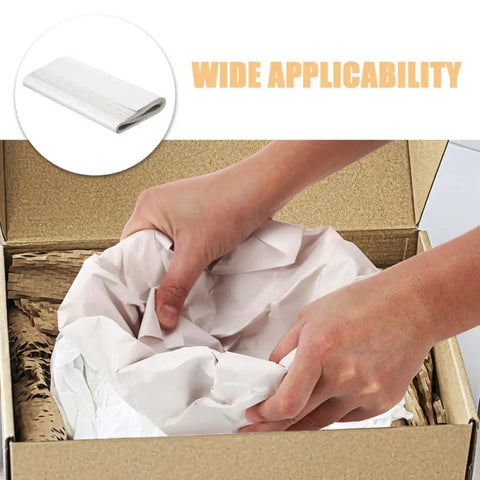 Hands wrapping items in 50 Sheets White Newsprint Paper For Moving And Shipping Wrapping And Cushioning Antiques And Mirrors.