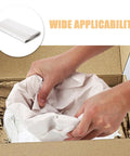 Hands using White Newsprint Packing Paper 50 Sheets For Wrapping And Cushioning Fragile Items Perfect For Moving Shipping Handling.