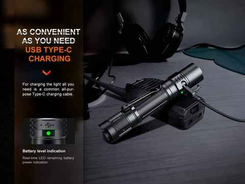 Beast Mode Tactical Flashlight With USB C Rechargeable Battery 1700 Lumens Beam That Reaches Up To 386 Yards on table