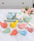 Super Clean White Bird Design Toilet Bolt Caps With Elegant Porcelain Screw Covers To Conceal Ugly Hardware And Level Up Your Bathroom Setup Effortlessly Inside This Solid Four Pack Collection, featuring colorful bird shapes in various colors.