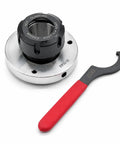 Upgrade your Shop Game With This Awesome Nakkaa ER32 Collet Chuck, 80mm Big Diameter And Insane Precision For Your CNC Milling Machine Setup. Black collet chuck and red wrench.