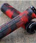 Red and black textured grips with waffle pattern, single lock-on collar. Lock On Mountain Bike And BMX Grips Dope Non Slip Hand Hugging Comfort.
