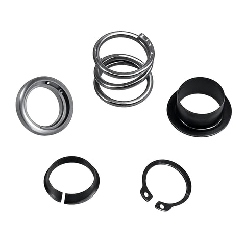 KPALAG steering column upper bearing kit components: metal bearing rings, black plastic spacer, and retaining rings.