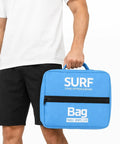 Person holding blue Insulated Cooling Pack for Seaside Adventures and Water Sports, Anti Splash Storage Pouch for Stand Up Paddleboards.