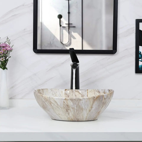 Oval Marble Vessel Sink With Pop Up Drain For Above Counter Bathroom Ceramic Vessel Sink With Nordic Marbling Modern European Style Countertop Sink For Master Bath Or Powder Room Totally Eye Catching Oval Sink Bowls placed on a white countertop under a mirror.