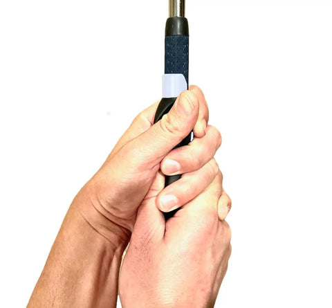 Hands gripping a club using the Left Handed Golf Grip Trainer Golf Swing Aid Attachment To Correct Hand Placement And Grip For Pro Style Setup Easy Practice Tool For Consistency Quick Grip Correction And Smarter Swing Mechanics.