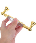 Hand holding Two Pack Colorful Glass Cabinet Door Handles With Crystal Center Long Metal Drawer Pulls For Kitchen Closet Dresser And Furniture Hardware Durable And Easy To Install