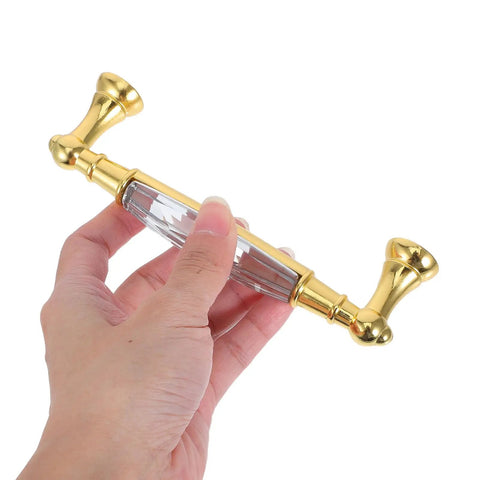 Hand holding Two Pack Colorful Glass Cabinet Door Handles With Crystal Center Long Metal Drawer Pulls For Kitchen Closet Dresser And Furniture Hardware Durable And Easy To Install