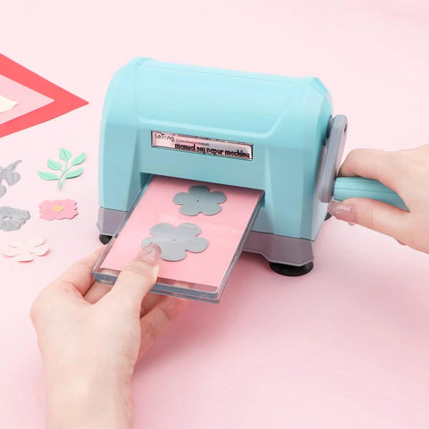 Portable Die Cutting And Embossing Machine For Card Making And Scrapbooking No Fuss Mini Cutter in use with pink paper