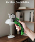 Person holding Cordless Cardboard Cutter With Rechargeable 4V Motor Electric Box Cutter Includes 2 Blades Safety Lock And LED Light