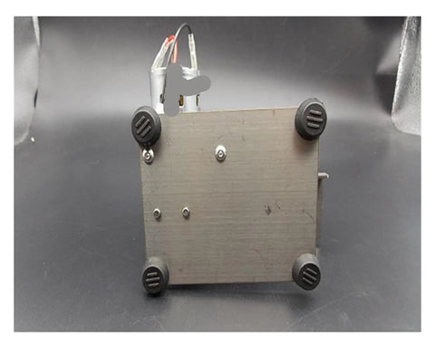 Mini electric belt sander base with four rubber feet, showcasing the motor connection for desktop sanding and polishing.