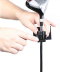 Hands setting up Golf Swing Recording Clip Mount For Phone, Easy Setup Training Aid That Stabilizes Your Phone To Capture Every Swing.