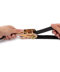 Hands using Endless Ratchet Straps No Hook Nylon Tie Downs for Motorcycles and Kayaks, black strap, gold ratchet mechanism.