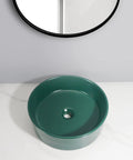 Bathroom Sink Bathroom Round Non-Porous Ceramic Wash Basin Dark Green Wash Basin Bathroom Art Above Counter Basin Bathroom Sink Vessel on marble surface.
