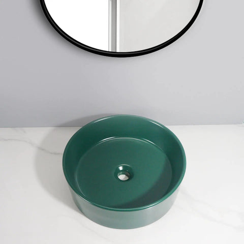 Bathroom Sink Bathroom Round Non-Porous Ceramic Wash Basin Dark Green Wash Basin Bathroom Art Above Counter Basin Bathroom Sink Vessel on marble surface.