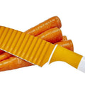 Crinkle-cut knife, front view, yellow handle, stainless steel blade with large wavy edge for vegetables.