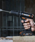 Heavy Duty Cordless Impact Drill Equipped With Killer Dual Speed Motor And 18 Precision Torque Settings For No Sweat Home Repairs And Rock Solid Construction Power, held in hand, drilling into wood