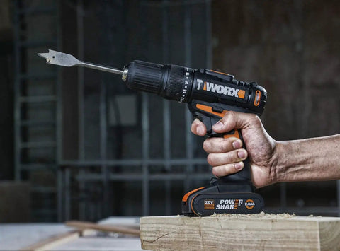 Heavy Duty Cordless Impact Drill Equipped With Killer Dual Speed Motor And 18 Precision Torque Settings For No Sweat Home Repairs And Rock Solid Construction Power, held in hand, drilling into wood