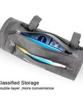 Front Frame Bike Handlebar Bag Waterproof Storage Bag With Large Capacity showing zippered compartments open with items inside