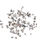 Watch Screws Kit 100 Pieces Micro Screw Assortment scattered on white surface for battery clamp replacement and quick watch repair gear.