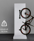 Heavy Duty Wall Mounted Bike Rack For Mountain Bikes No Lift Easy Rear Wheel Loading Space Saving Garage Storage Solution For Home Or Bike Park Sturdy Steel With UV Treated Plastic Holds Up To 77 Lbs displaying a bike vertically.