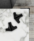 Silicone Corner Guards 4 Pack For Furniture And Tables, Easy To Install Edge Bumpers, shown on a marble table corner