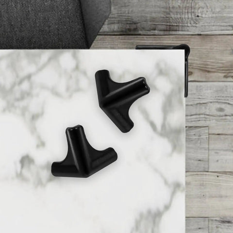 Silicone Corner Guards 4 Pack For Furniture And Tables, Easy To Install Edge Bumpers, shown on a marble table corner