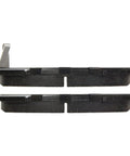 Side view of a pair of Centric ceramic front brake pads with a metal retention tab on the left.