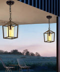 Outdoor Porch Pendant Light With Glass Shade, Vintage Metal Cage Lantern, classic black finish, shown installed on porch